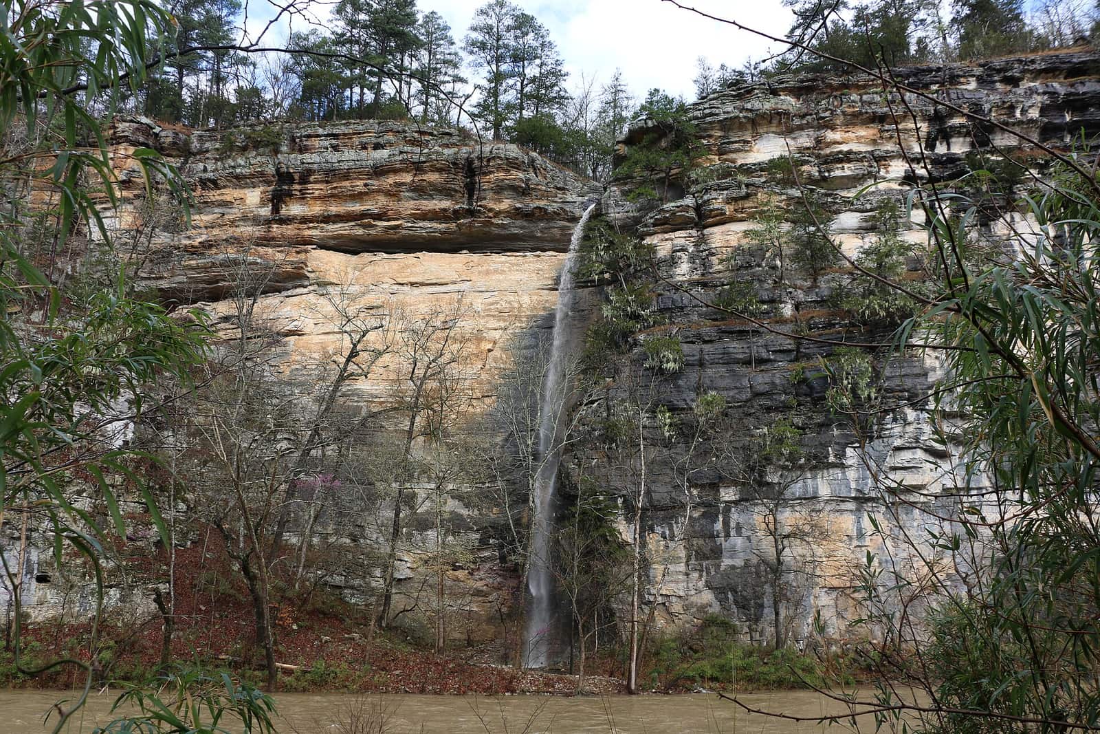 A perennial waterfall pours off of Roark Bluff during a spring flood event (1e1c251a-d45e-4447-b13b-408f6317ef98)